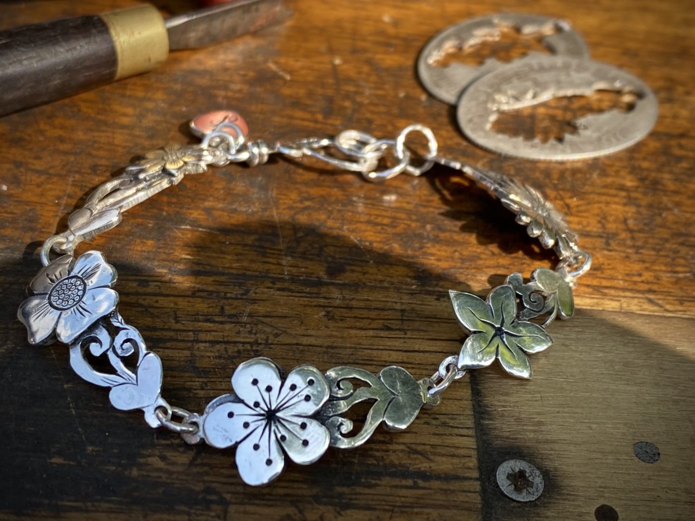 flower bracelet made from recycled sterling silver coins