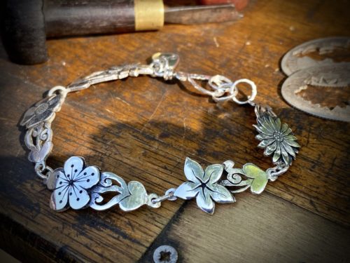 flower bracelet made from recycled sterling silver coins