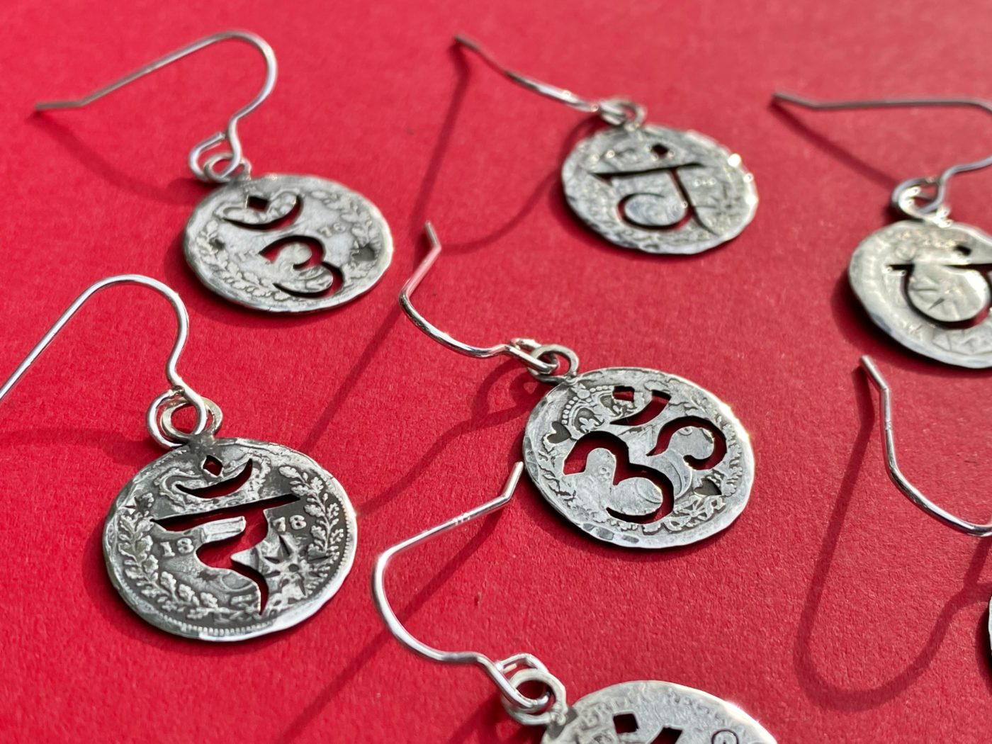 handcrafted and recycled silver threepence coin yoga earrings