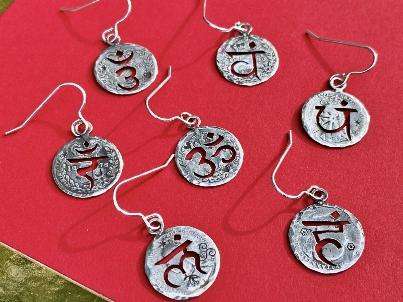 handcrafted and recycled silver threepence coin yoga earrings