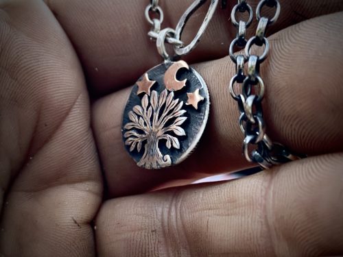 handcrafted and recycled sterling silver sixpence coin transformed into a sweet little tree necklace