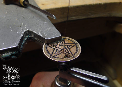 Hand cut pentacle coin pendant made as a personal talisman in the Hg workshop