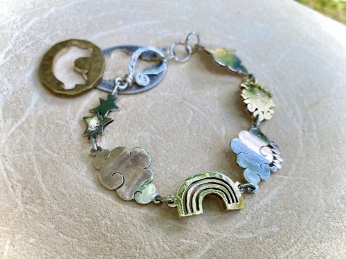 weather cloud sunshine bracelet handmade from up cycled silver coins and brass bronze coins