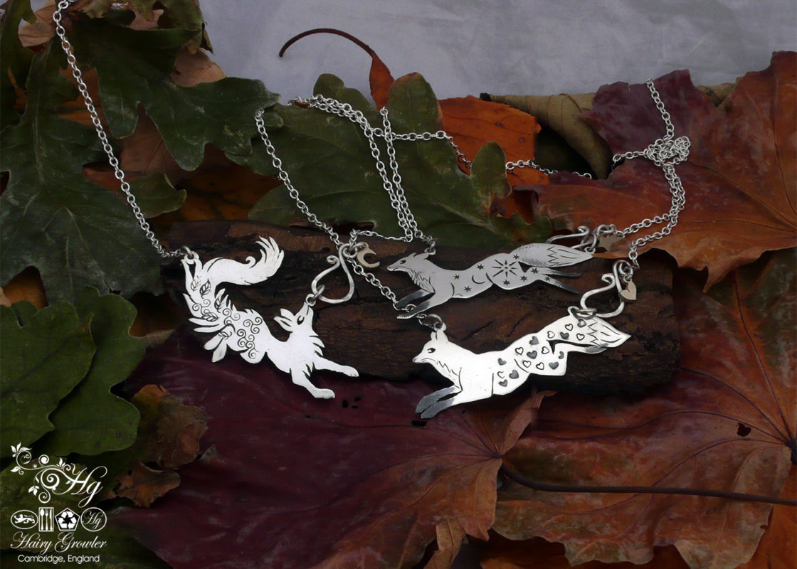 Vixen necklace - Hairy Growler - Leaping foxes and dancing vixens.