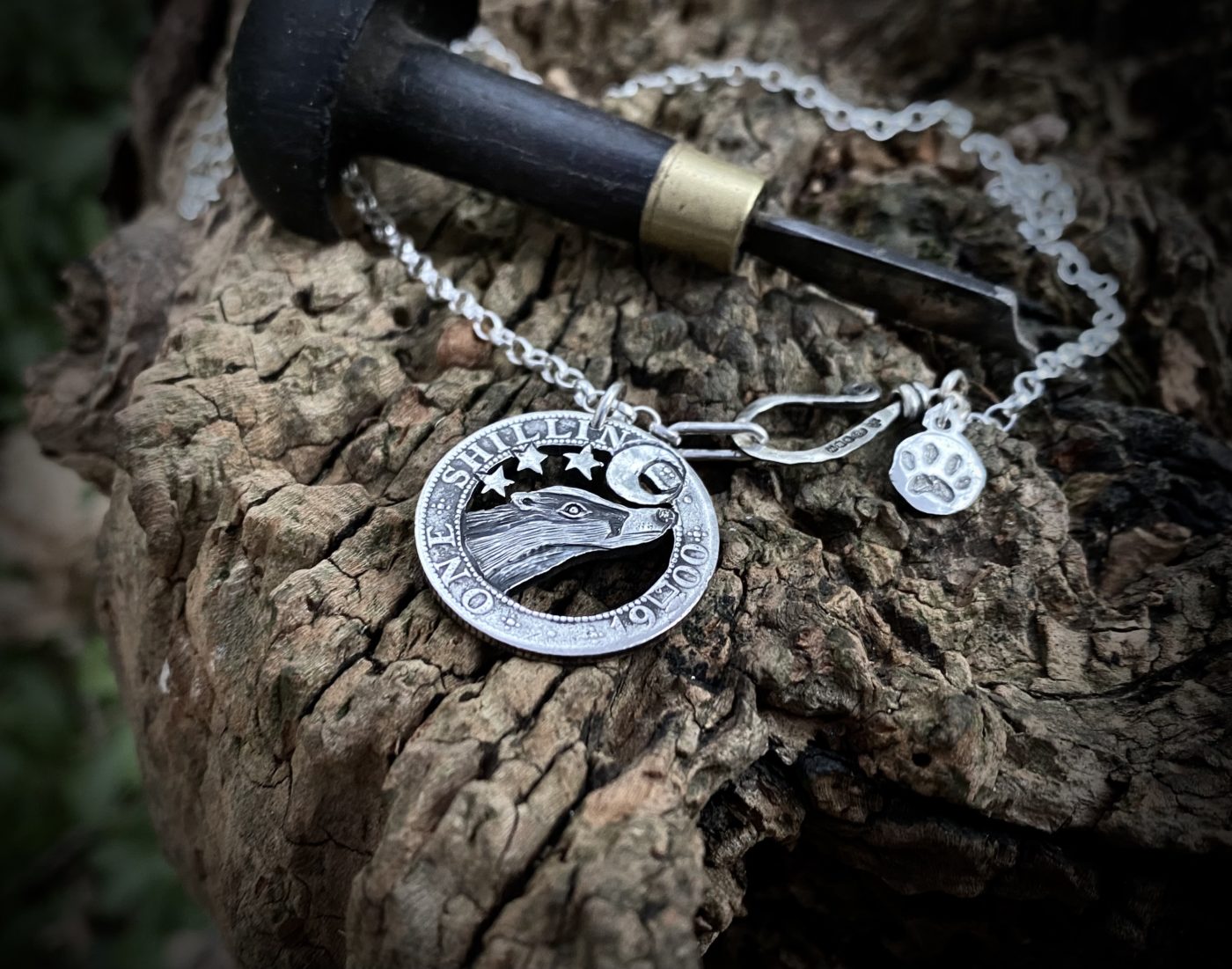 Handcrafted and recycled silver shilling The Silver Shilling collection. silver badger necklace totally handcrafted and recycled from old sterling silver shilling coins. Designed and created by Hairy Growler Jewellery, Cambridge, UK. necklace