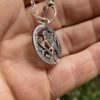 Handmade and completely upcycled and repurposed silver shilling robin red breast necklace pendant