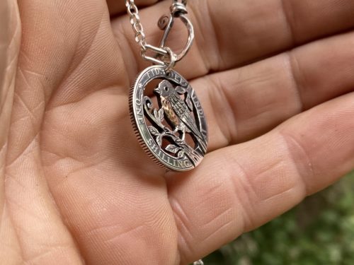 Handmade and completely upcycled and repurposed silver shilling robin red breast necklace pendant