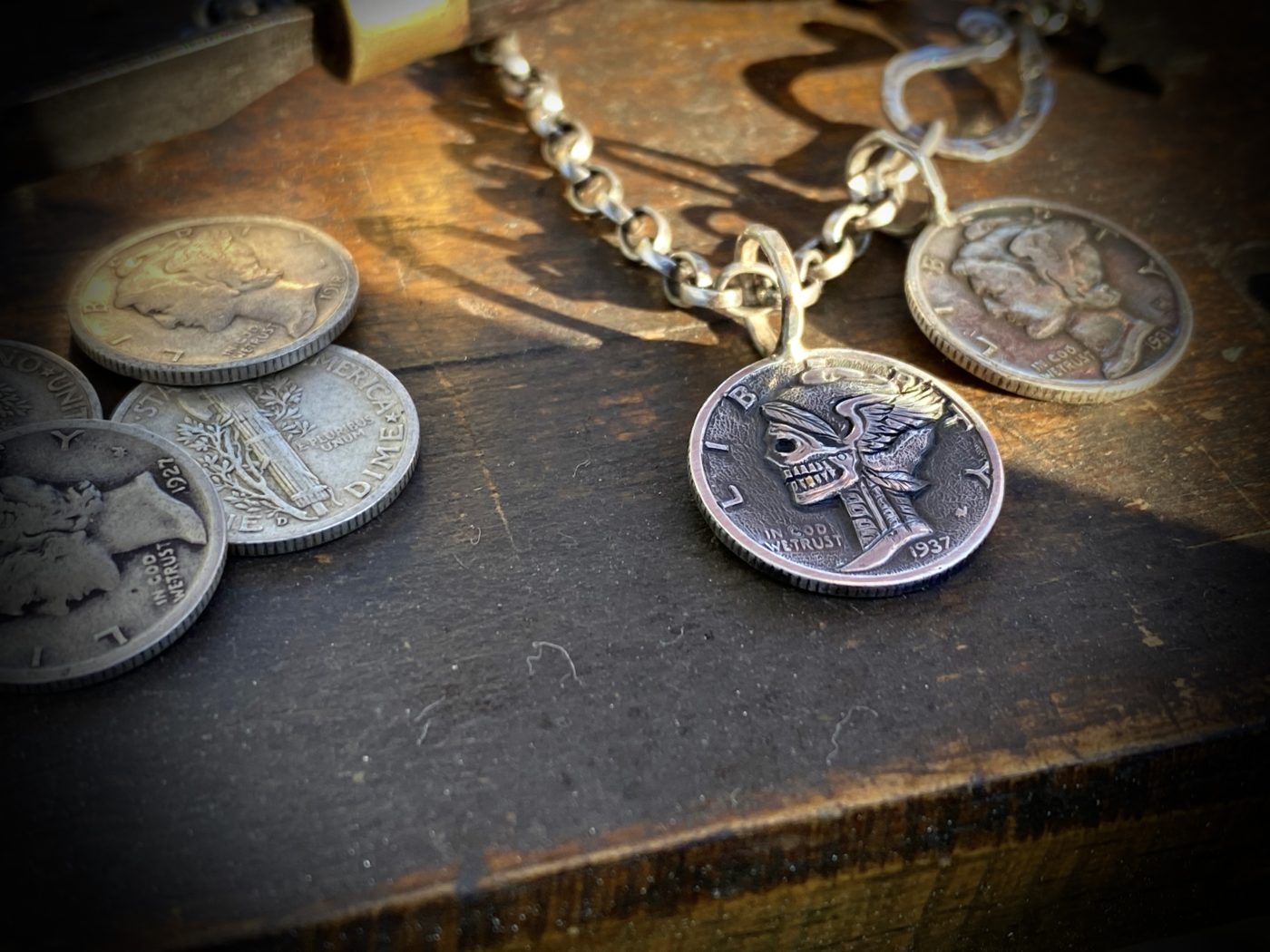 Hand-carved and recycled silver dime liberty coin skull necklace