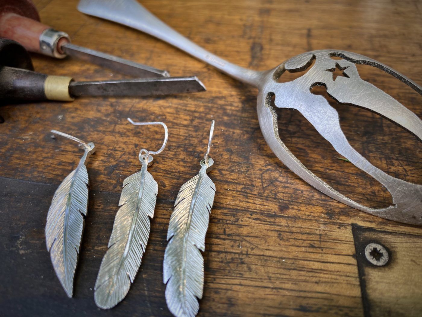 feather earrings made from recycled spoons