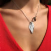 Ash tree leaves necklace - handcrafted and recycled ethical jewellery made from silver Victorian Florins.