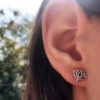 rebirth and regeneration louts flower and om earrings handmade and recycled silver coin
